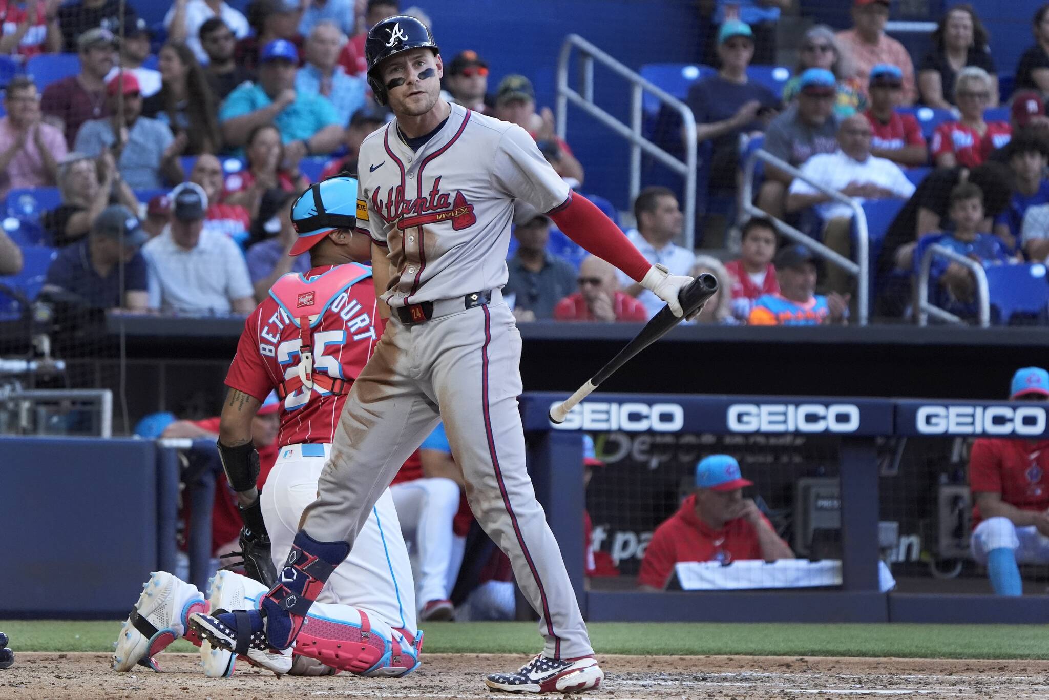 Atlanta Braves’ Jarred Kelenic reacts after striking out swinging during the fifth inning of a baseball game against the Miami Marlins, Saturday, April 13, 2024, in Miami. (AP Photo/Wilfredo Lee)