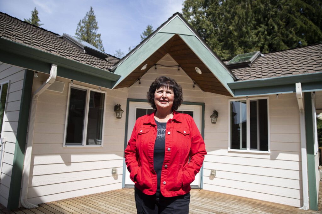 Penny Clark, owner of Travel Time of Everett Inc., at her home office on Tuesday, April 23, 2024 in Arlington, Washington. (Olivia Vanni / The Herald)
