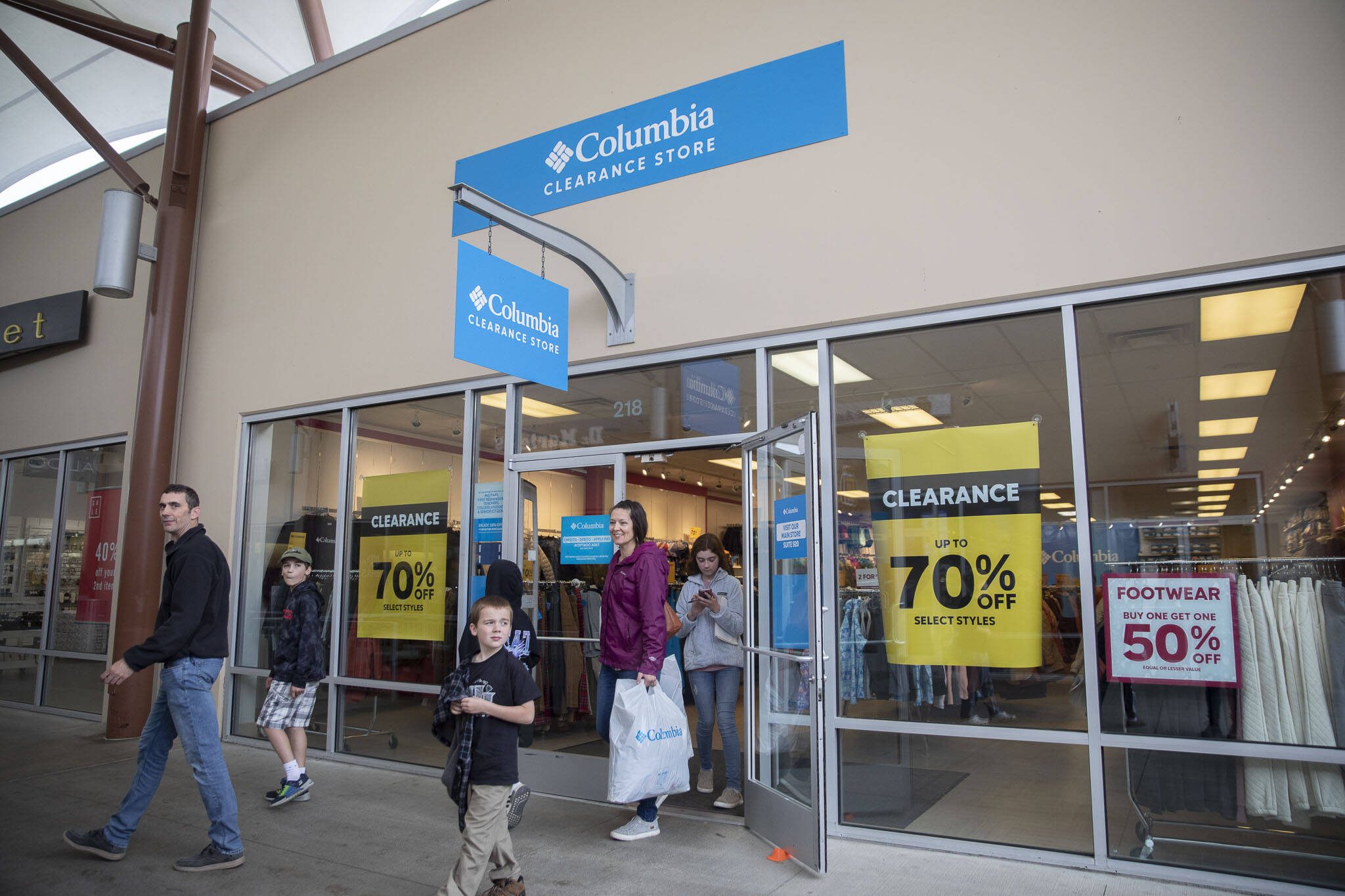 People walk out of the Columbia Clearance Store at Seattle Premium Outlets on Thursday, April 25, 2024 in Quil Ceda Village, Washington. (Olivia Vanni / The Herald)