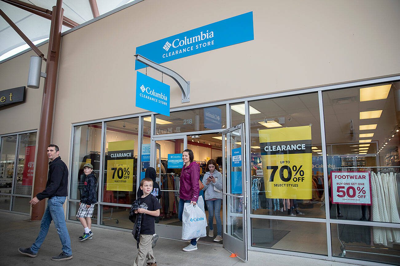 People walk out of the Columbia Clearance Store at Seattle Premium Outlets on Thursday, April 25, 2024 in Quil Ceda Village, Washington. (Olivia Vanni / The Herald)