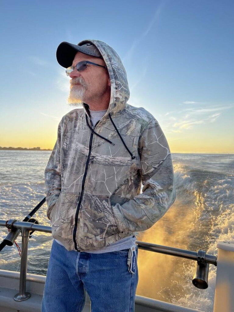 John Wightman stands on a charter boat at his family’s annual fishing trip out of Westport, Washington in June 2023. (Photo provided by Kristen Velez)
