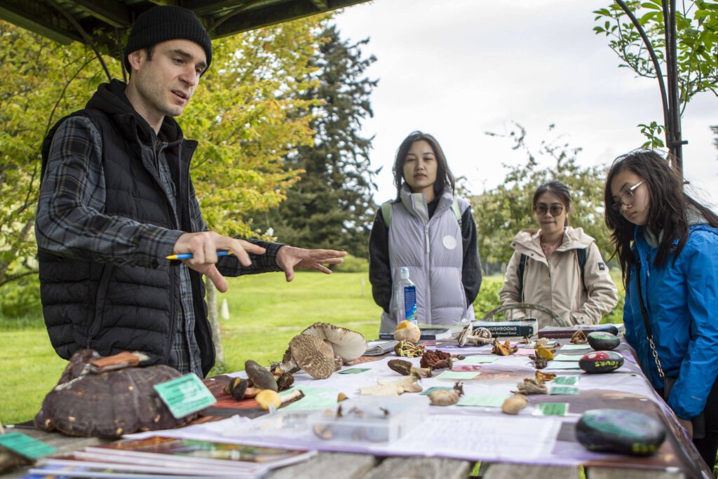 Travis Furlanic leads his presentation during a Whidbey Wild Mushroom Tour at South Whidbey Tilth Farmers Market on Saturday, April 27, 2024 in Langley, Washington. (Annie Barker / The Herald)

