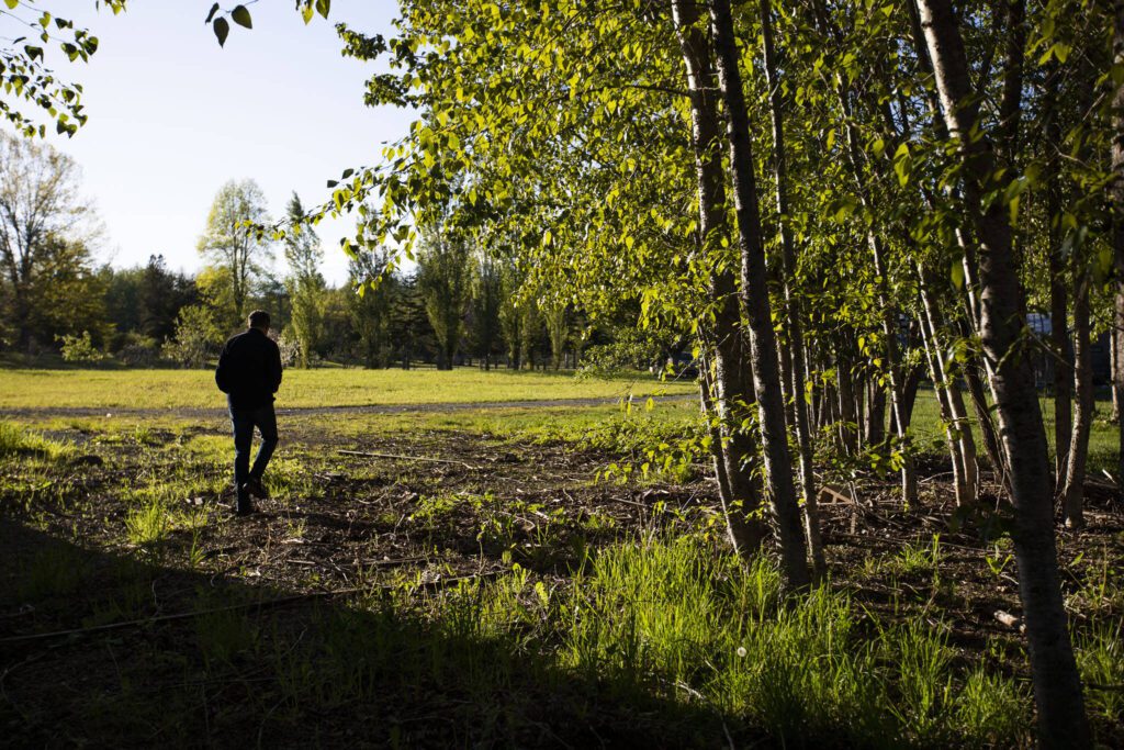 Don Doody walks around the expansive property. (Olivia Vanni / The Herald)
