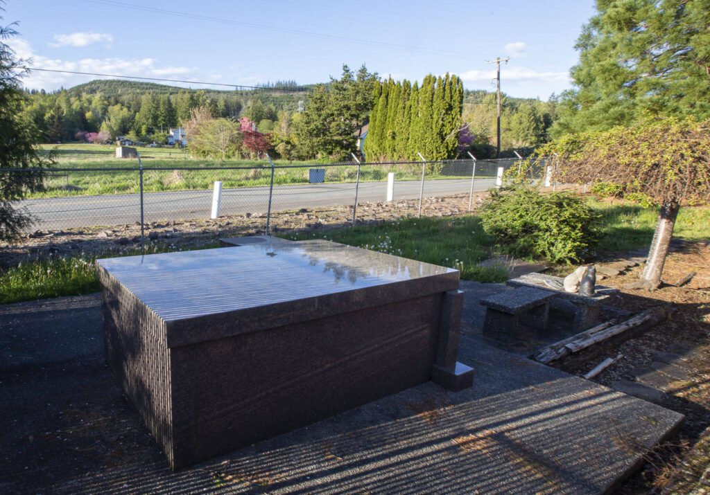 The grave of the original owner of the home is located next to the property. (Olivia Vanni / The Herald)
