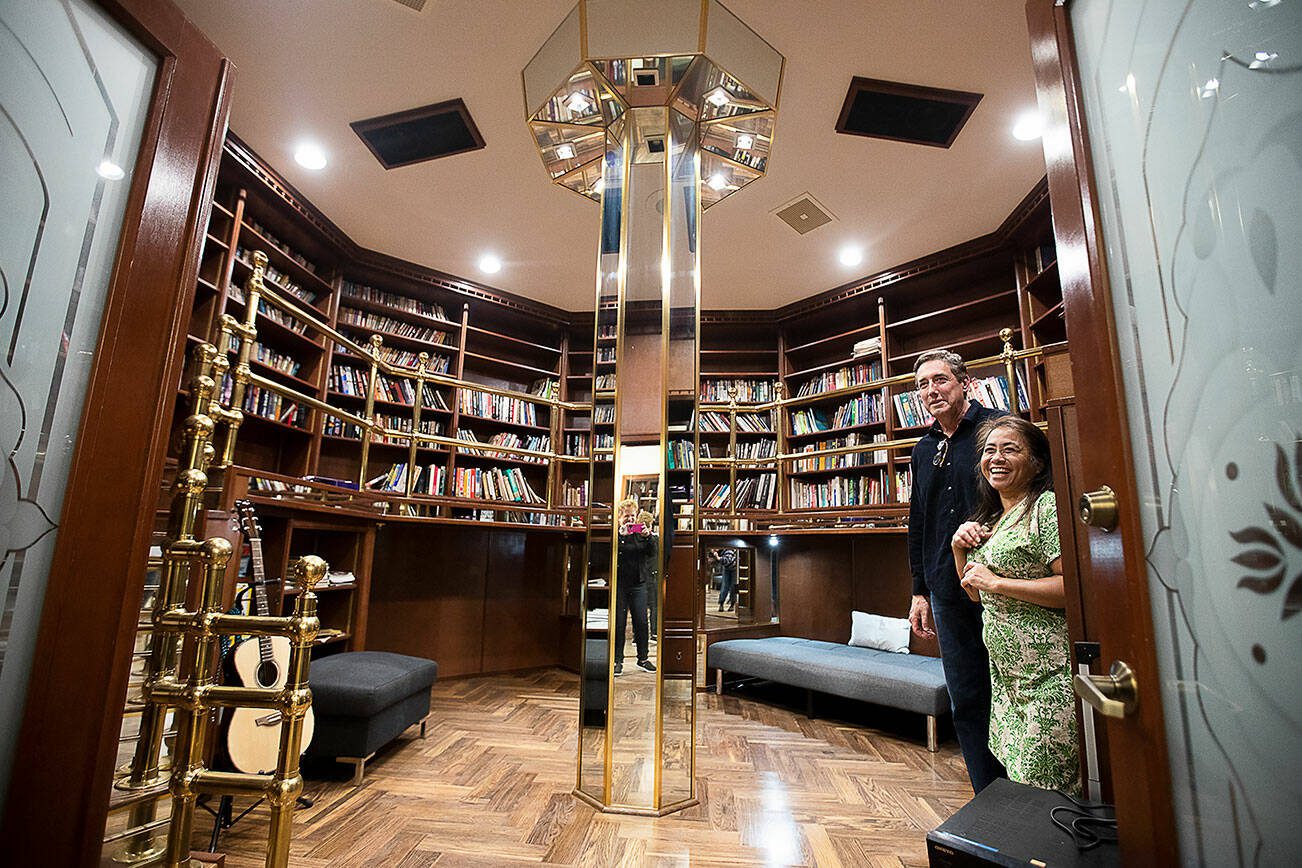 Emma Corbilla Doody and her husband, Don Doody, inside  their octagonal library at the center of their octagon home on Thursday, May 2, 2024 in Sultan, Washington. (Olivia Vanni / The Herald)