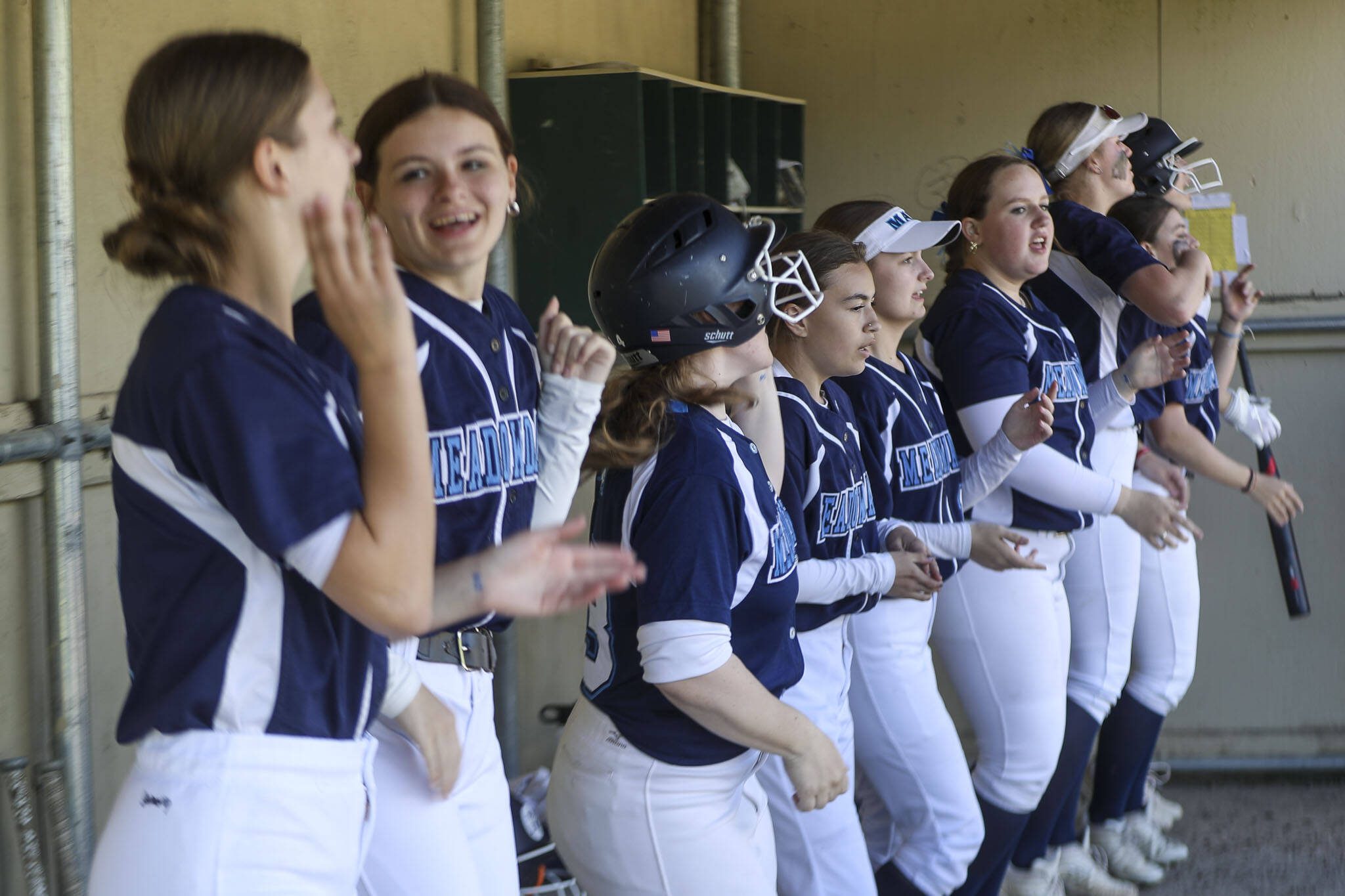 Meadowdale players cheer during a softball game between Meadowdale and Marysville Getchell on Wednesday, May 1, 2024 in Marysville, Washington. Meadowdale won, 12-9. (Annie Barker / The Herald)