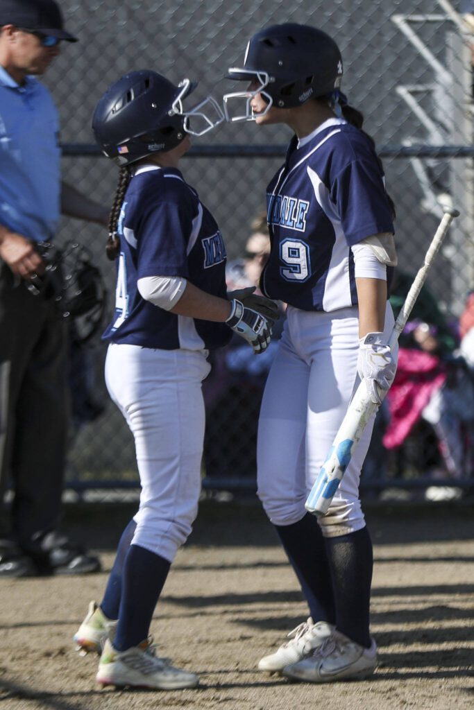 Meadowdale players react during a softball game between Meadowdale and Marysville Getchell on Wednesday, May 1, 2024 in Marysville, Washington. Meadowdale won, 12-9. (Annie Barker / The Herald)
