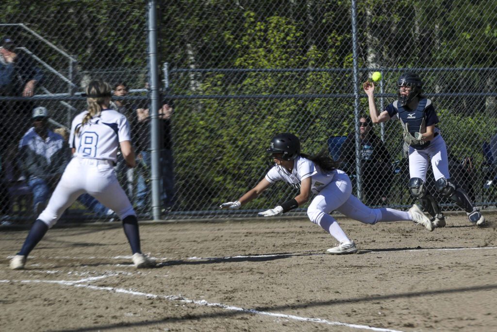 Marysville Getchell’s Lilyana Balgos (4) dives during a softball game between Meadowdale and Marysville Getchell on Wednesday, May 1, 2024 in Marysville, Washington. Meadowdale won, 12-9. (Annie Barker / The Herald)
