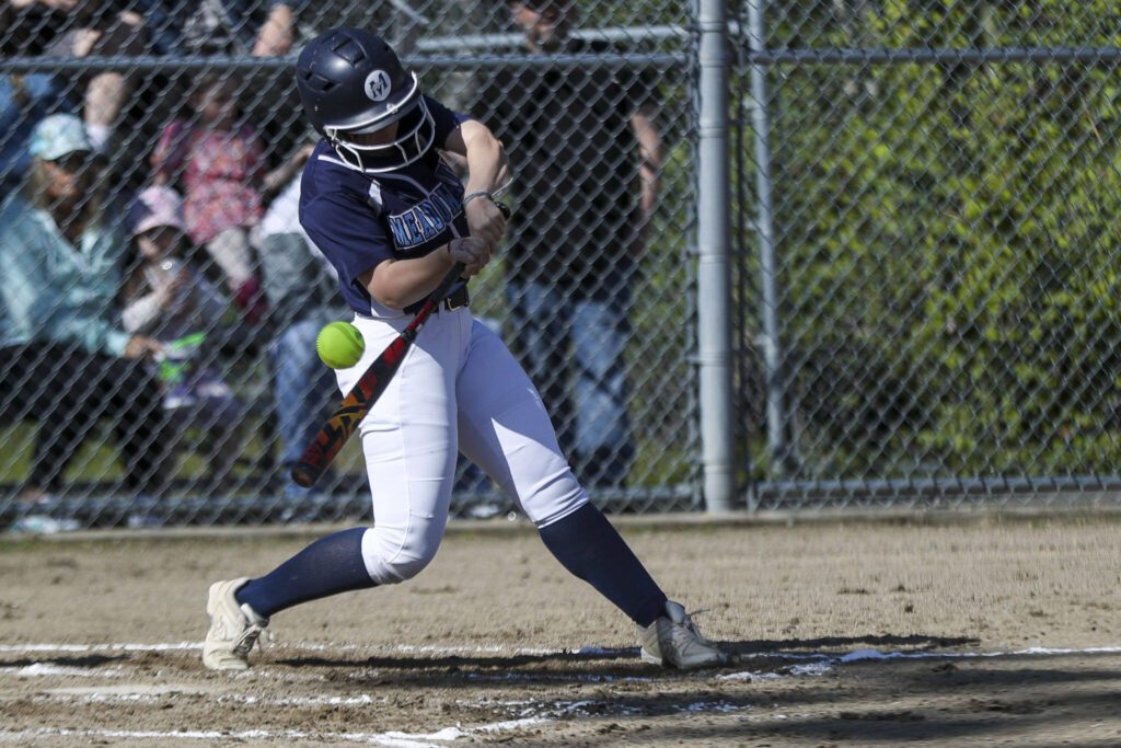 Meadowdale’s MacKenzie Kim (5) swings during a softball game between Meadowdale and Marysville Getchell on Wednesday, May 1, 2024 in Marysville, Washington. Meadowdale won, 12-9. (Annie Barker / The Herald)
