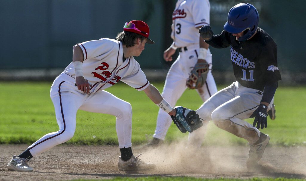 Meadowdale’s Nolan Webster (11) races for second during a District 1 3A baseball game between Meadowdale and Snohomish at Snohomish High School on Monday, April 30, 2024 in Snohomish, Washington. Snohomish won, 3-1. (Annie Barker / The Herald)
