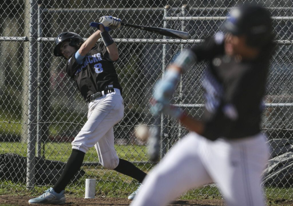 Meadowdale’s Nicholas Zardis (8) warms up during a District 1 3A baseball game between Meadowdale and Snohomish at Snohomish High School on Monday, April 30, 2024 in Snohomish, Washington. Snohomish won, 3-1. (Annie Barker / The Herald)
