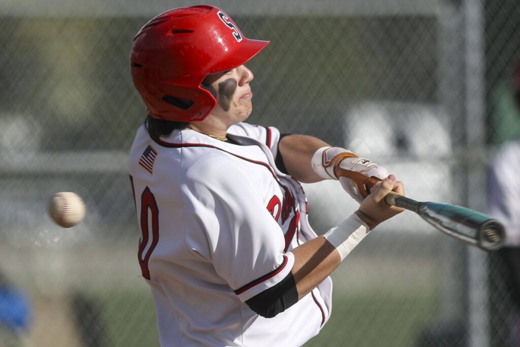 Snohomish’s Enzo Porletto (10) swings during a District 1 3A baseball game between Meadowdale and Snohomish at Snohomish High School on Monday, April 30, 2024 in Snohomish, Washington. Snohomish won, 3-1. (Annie Barker / The Herald)
