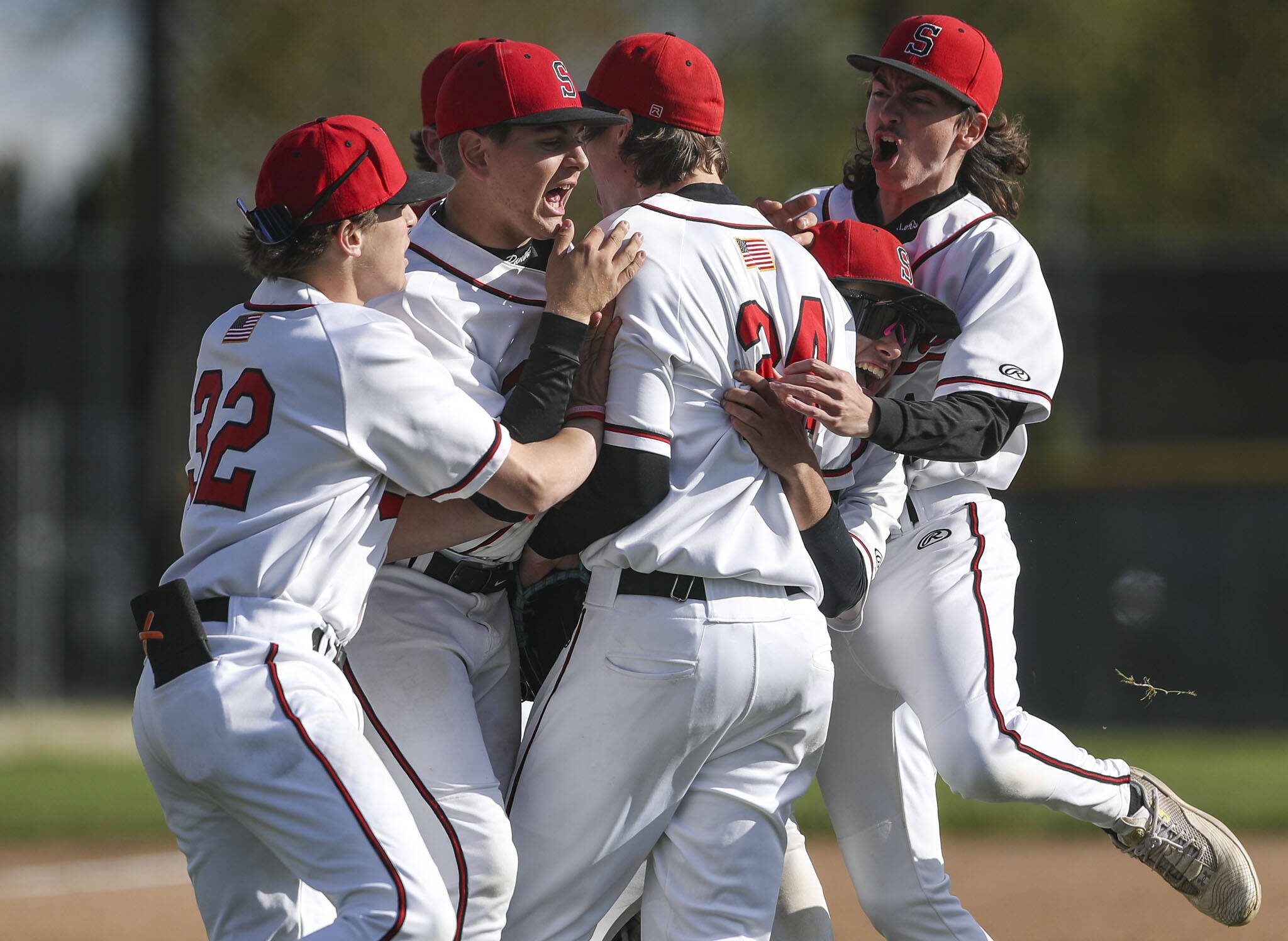 Snohomish players celebrate during a District 1 3A baseball game between Meadowdale and Snohomish at Snohomish High School on Monday, April 30, 2024 in Snohomish, Washington. Snohomish won, 3-1. (Annie Barker / The Herald)
