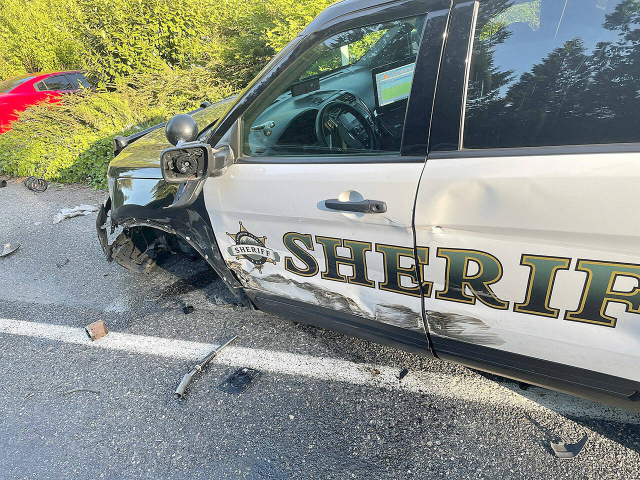 A driver in a Tesla reportedly using the vehicle’s Autopilot feature allegedly crashed into a Snohomish County Sheriff’s Office patrol SUV that was parked on the roadside in Lake Stevens in May 2021. There were no reported injuries. (Snohomish County Sheriff’s Office / Herald file)