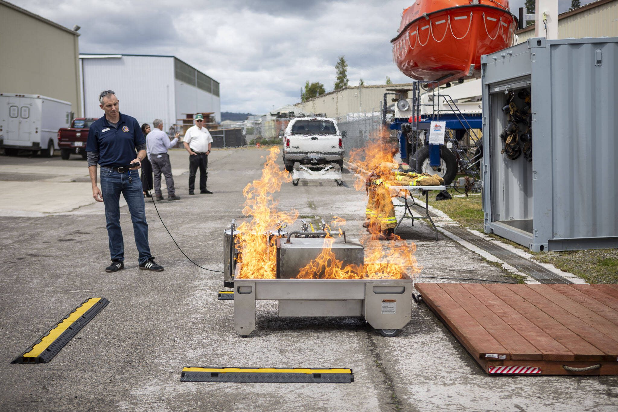 Brian Hennessy leads a demonstration of equipment used in fire training at the Maritime Institute in Everett, Washington on Wednesday, May 22, 2024. (Annie Barker / The Herald)