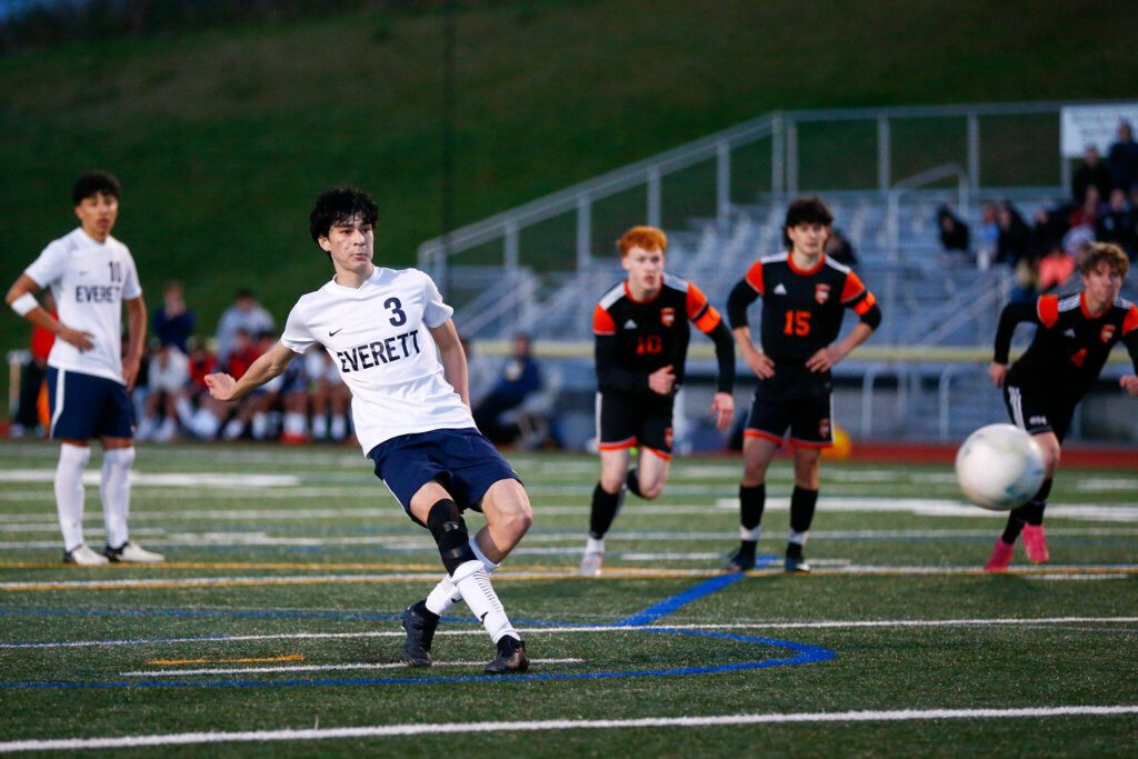 Everett’s Stephen Post puts a late penalty kick in the back of the next to send a 3A District soccer match against Monroe to extra time on Thursday, May 2, 2024, at Monroe High School in Monroe, Washington. (Ryan Berry / The Herald)
