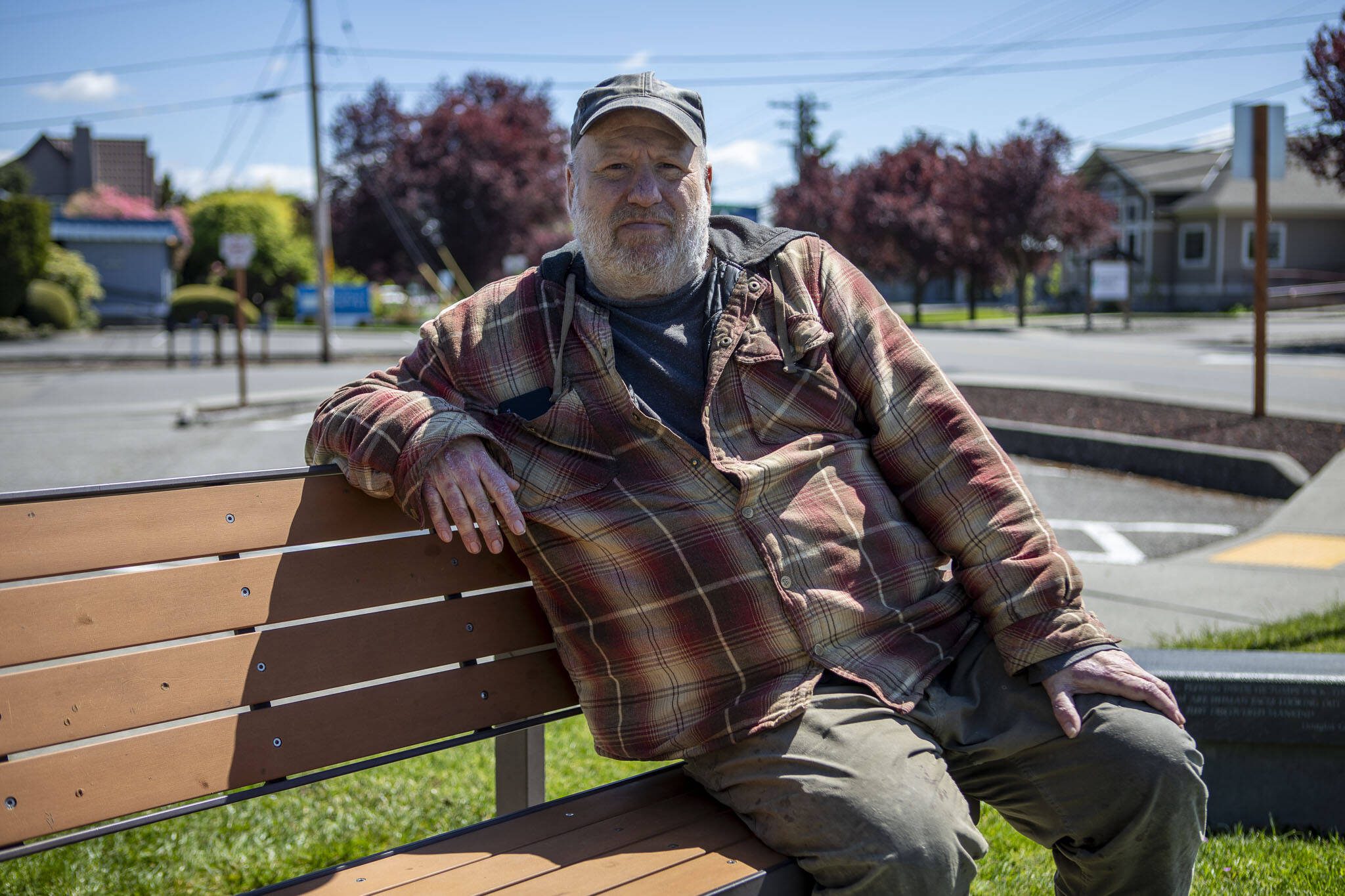 George Beard poses for a photo outside of the the Stanwood Library in Stanwood, Washington on Wednesday, May 8, 2024.  (Annie Barker / The Herald)