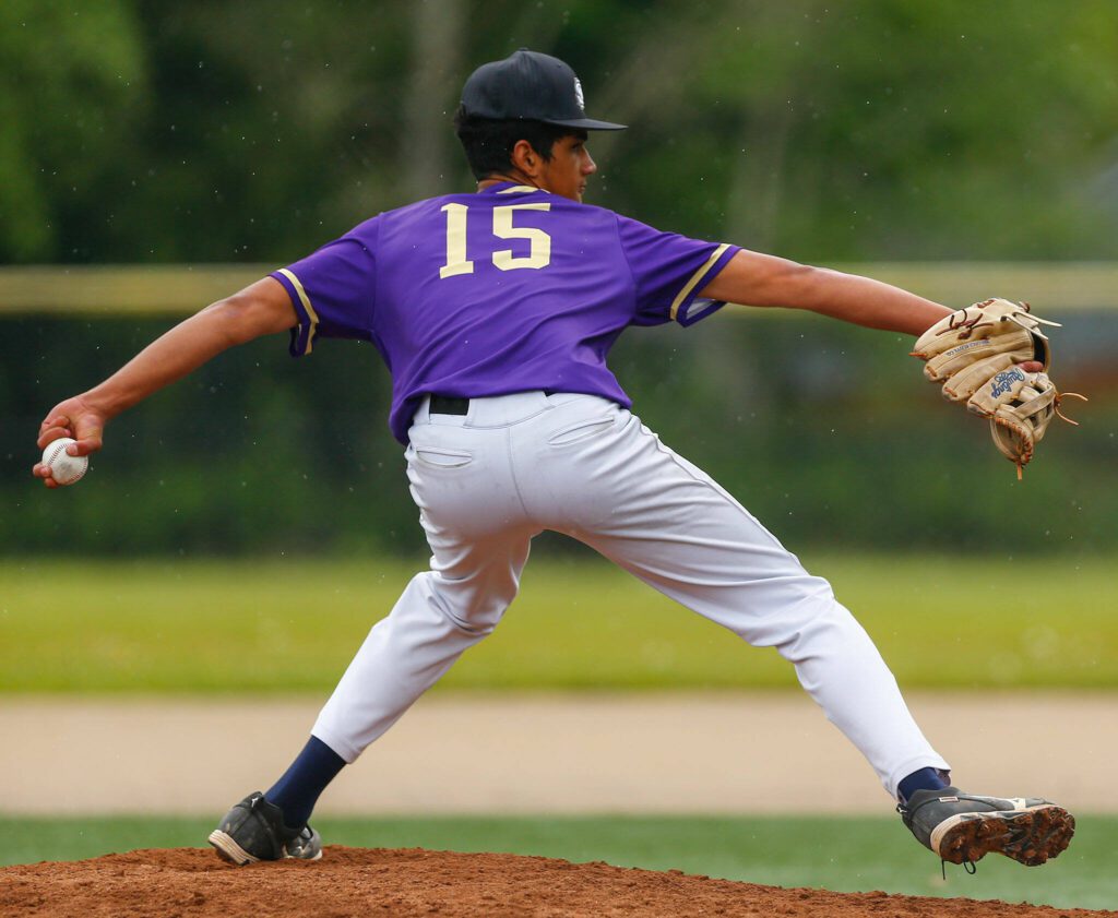 Lake Stevens’ Manny McLaurin delivers a pitch during a playoff loss to Bothell on Saturday, May 4, 2024, in Lake Stevens, Washington. (Ryan Berry / The Herald)
