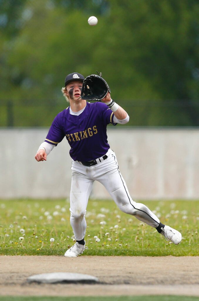 Lake Stevens shortstop Aspen Alexander fields a high chopper behind second base during a playoff loss to Bothell on Saturday, May 4, 2024, in Lake Stevens, Washington. (Ryan Berry / The Herald)
