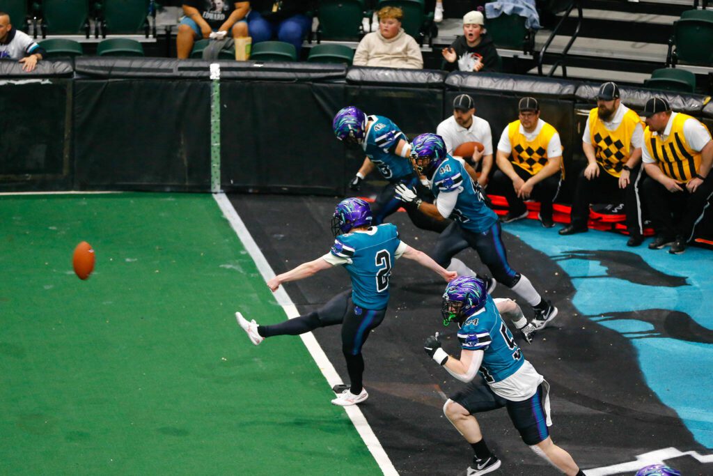 Kicker Wyatt Paul kicks off to begin the Washington Wolfpack’s inaugural home opener against Billings on Sunday, May 5, 2024, a Angel of the Winds Arena in Everett, Washington. (Ryan Berry / The Herald)
