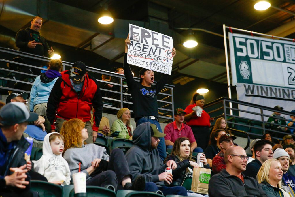 Free agent kicker Alberto Castaneda holds up a sign and shouts the he wants the job of Washington Wolfpack kicker Wyatt Paul during the tam’s inaugural home opener against Billings on Sunday, May 5, 2024, a Angel of the Winds Arena in Everett, Washington. (Ryan Berry / The Herald)
