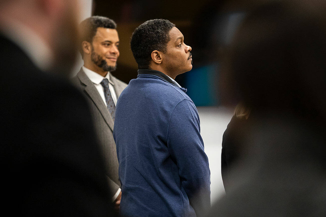 Jamel Alexander stands as the jury enters the courtroom for the second time during his trial at the Snohomish County Courthouse on Monday, May 6, 2024 in Everett, Washington. (Olivia Vanni / The Herald)