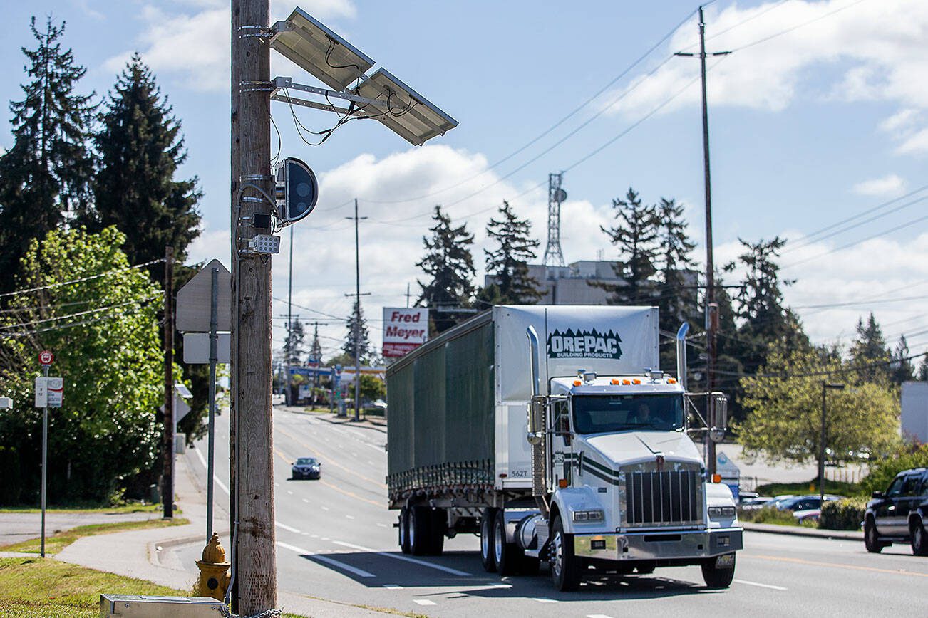 A truck drives west along Casino Road past a new speed camera set up near Horizon Elementary on Wednesday, May 8, 2024 in Everett, Washington. (Olivia Vanni / The Herald)