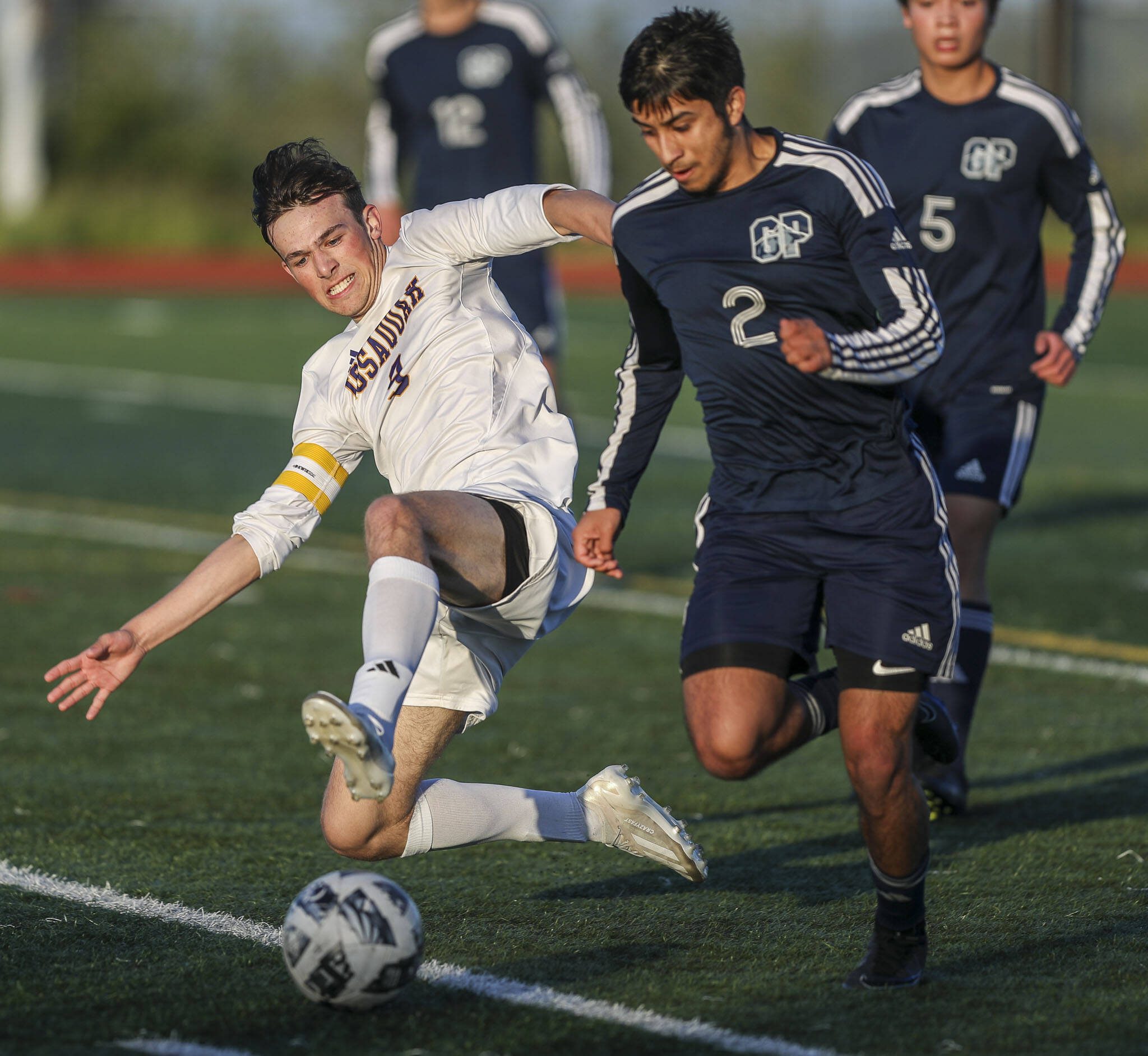 Issaquah’s Ryan Wilkinson (9) and Glacier Peak’s Gael Guerrero (2) fight for the ball and during a Class 4A District 1/2 boys soccer game between Glacier Peak and Issaquah at Glacier Peak High School in Snohomish, Washington on Tuesday, May 7, 2024. Issaquah won, 2-1. (Annie Barker / The Herald)