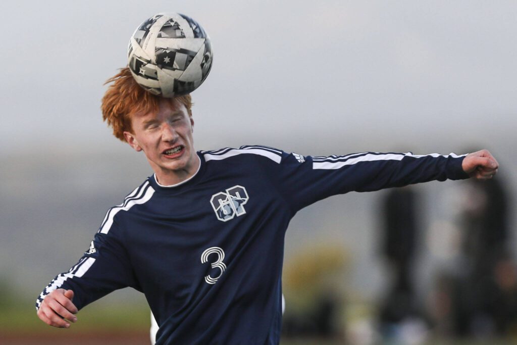 Glacier Peak’s Kollin Undseth (3) heads the ball during a Class 4A District 1/2 boys soccer game between Glacier Peak and Issaquah at Glacier Peak High School in Snohomish, Washington on Tuesday, May 7, 2024. Issaquah won, 2-1. (Annie Barker / The Herald)
