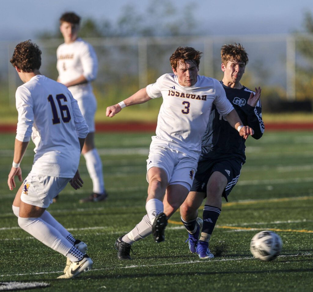 Issaquah’s Brecon Adams (3) and Glacier Peak’s Tyler Larsen (13) fight for the ball during a Class 4A District 1/2 boys soccer game between Glacier Peak and Issaquah at Glacier Peak High School in Snohomish, Washington on Tuesday, May 7, 2024. Issaquah won, 2-1. (Annie Barker / The Herald)
