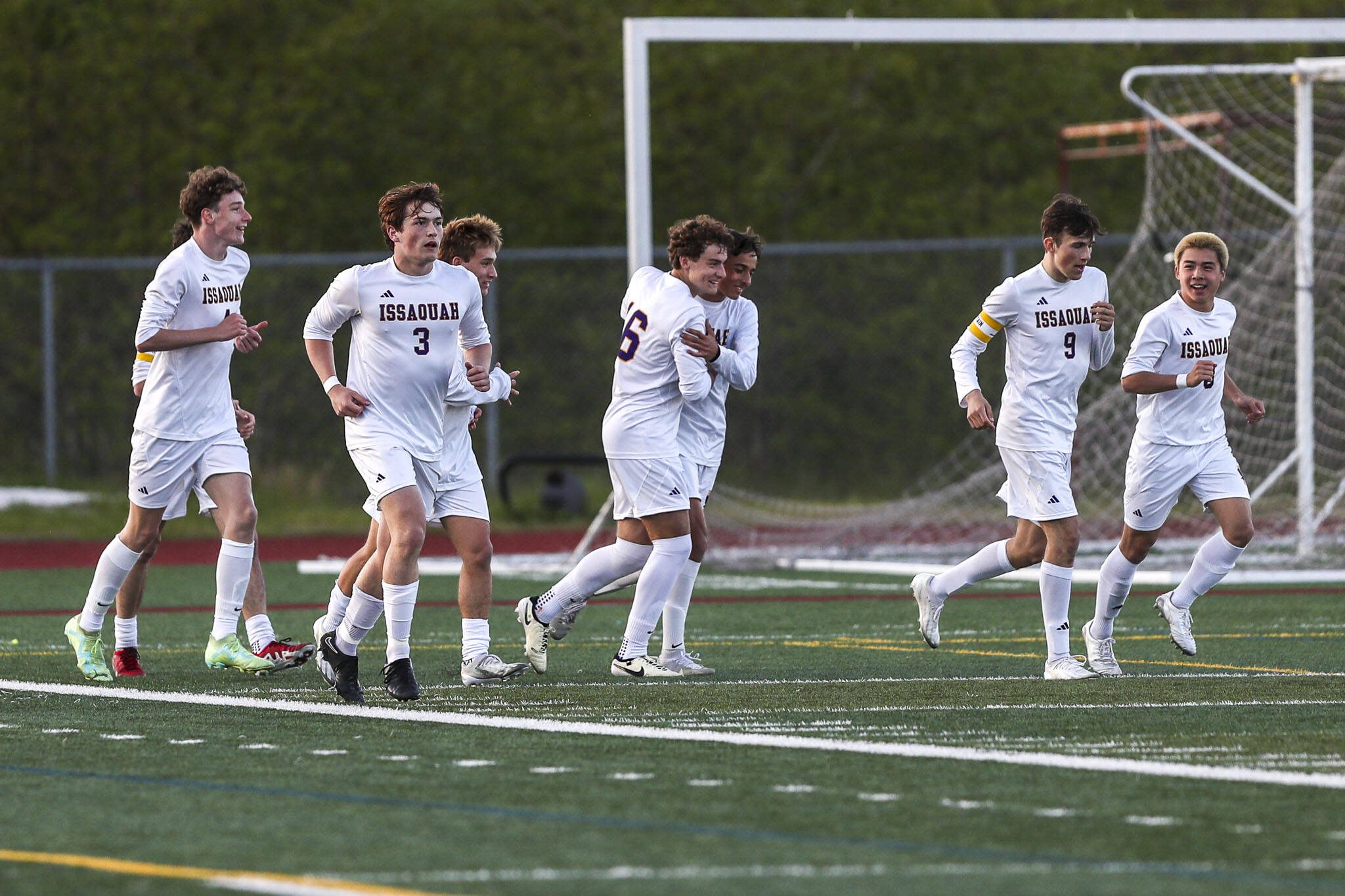 Issaquah players celebrate during a Class 4A District 1/2 boys soccer game between Glacier Peak and Issaquah at Glacier Peak High School in Snohomish, Washington on Tuesday, May 7, 2024. Issaquah won, 2-1. (Annie Barker / The Herald)