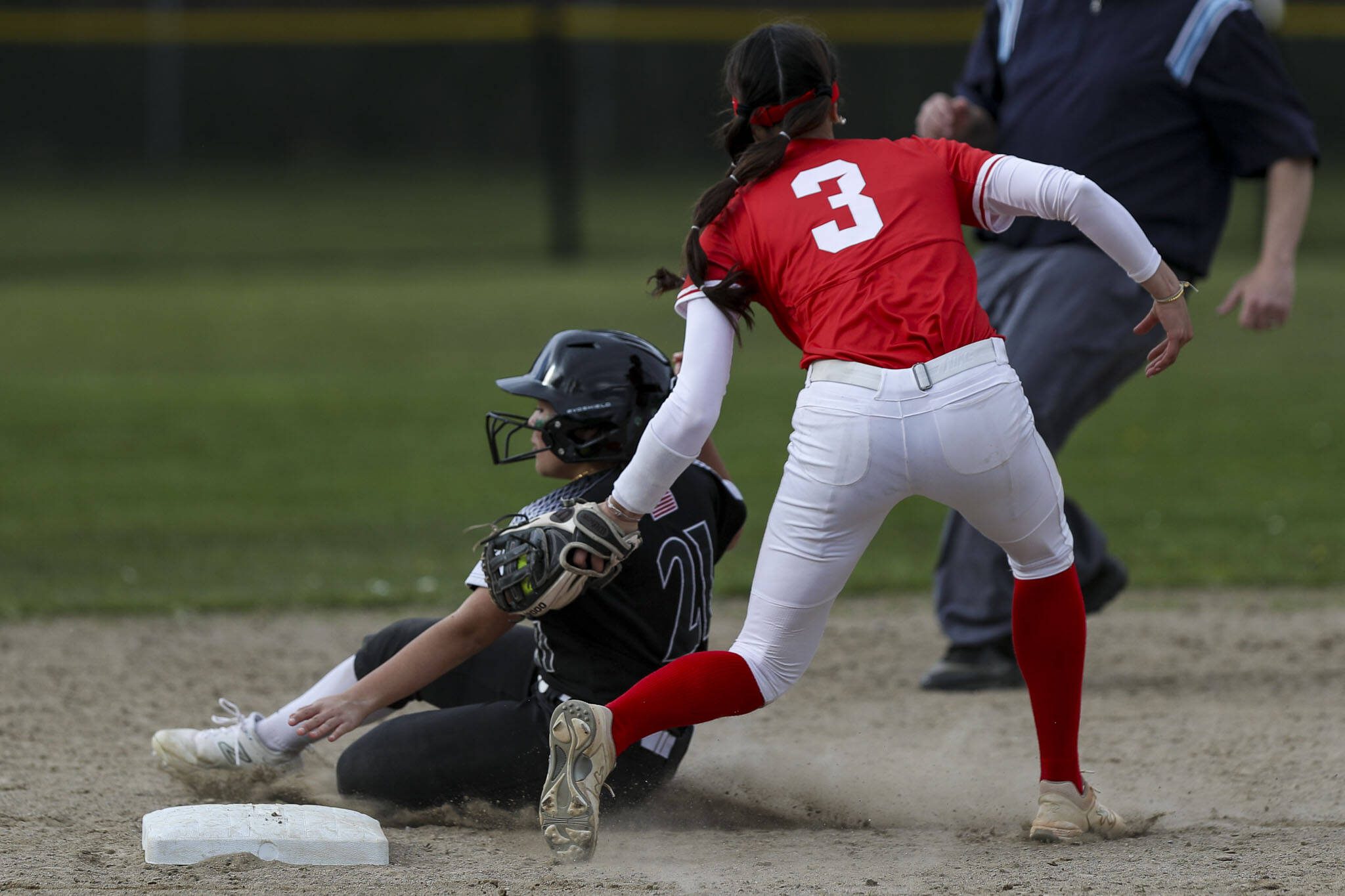 Stanwood’s Rubi Lopez (3) secures an out on second during a prep softball game between Stanwood and Jackson at Henry M. Jackson High School on Tuesday, April 2, 2024 in Mill Creek, Washington. (Annie Barker / The Herald)