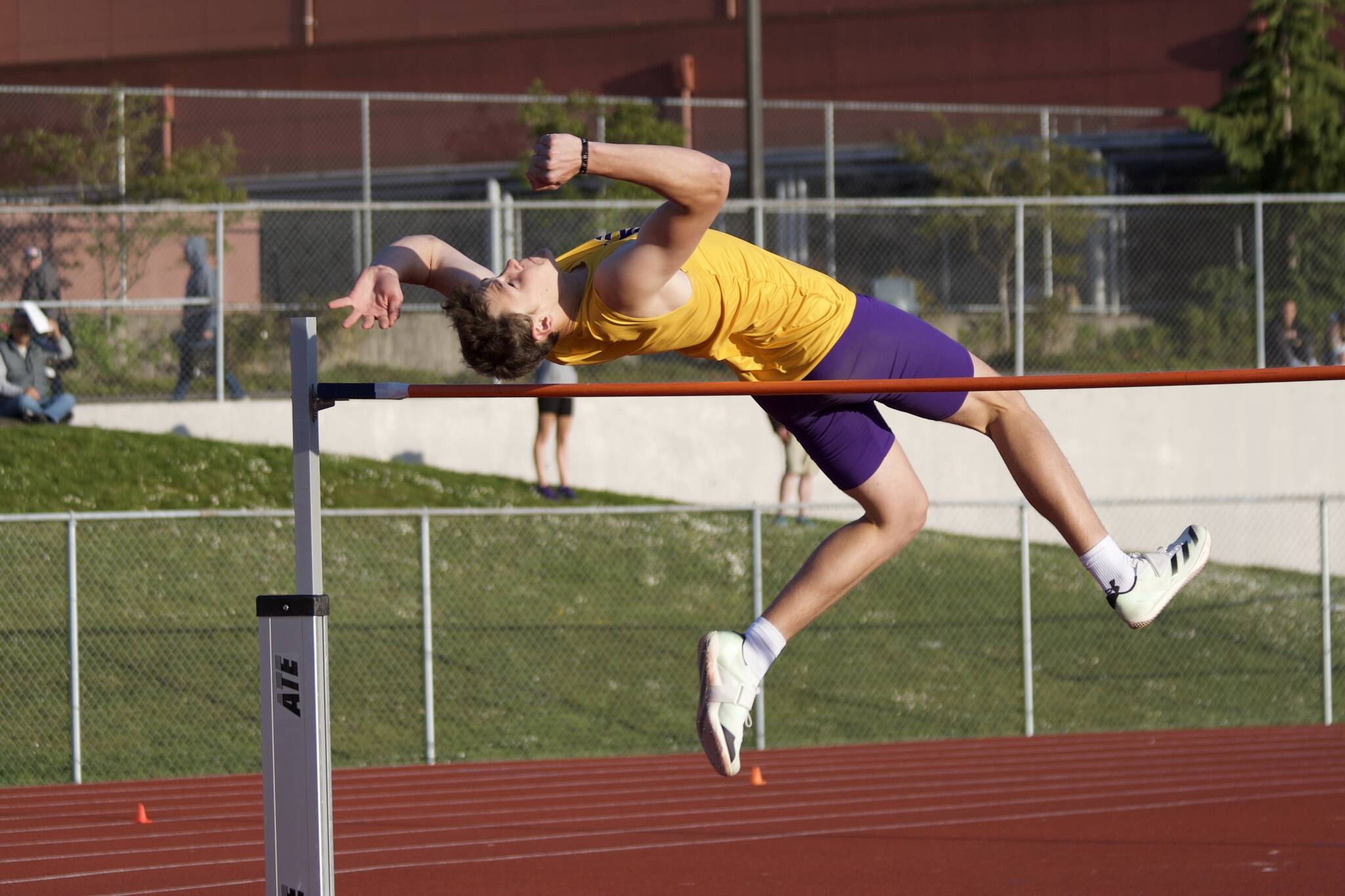 Lake Stevens junior Teagan Lawson arches his body over the high jump bar on the first day of the Wesco 4A League Championship on Wednesday at Snohomish High School. Lawson claimed the league title after clearing a 6-foot, 6-inch bar. (Taras McCurdie / The Herald)
