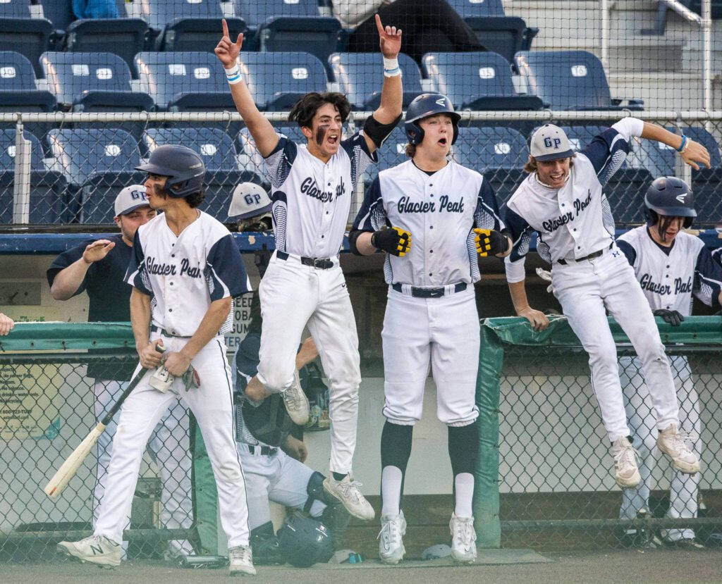The Glacier Peak dugout reacts to home run during the 4A district game against Bothell at Funko Field on Thursday, May 9, 2024 in Everett, Washington. (Olivia Vanni / The Herald)
