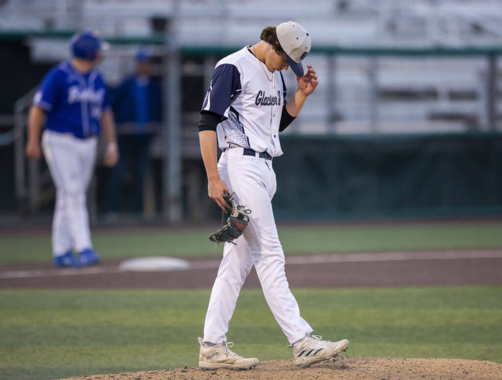 Glacier Peak’s Jake Doman walks up to the mound after giving up multiple runs during the 4A district game against Bothell at Funko Field on Thursday, May 9, 2024 in Everett, Washington. (Olivia Vanni / The Herald)
