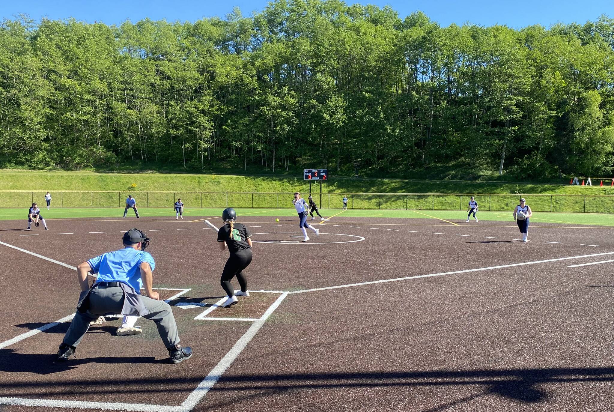 Arlington’s Peyton Aanstad pitches to Marysville Getchell’s Parker Johnson in the Class 3A District 1 softball tournament Friday at Phil Johnson Fields in Everett. The Chargers won the loser-out game 7-2 (Evan Wiederspohn / The Herald)