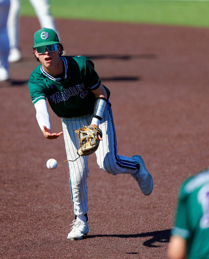 Edmonds-Woodway second baseman Andreas Simonsen flips the ball to first for an out against Mountlake Terrace in the Class 3A District 1 baseball championship Saturday, May 11, 2024, at Funko Field in Everett, Washington. (Ryan Berry / The Herald)
