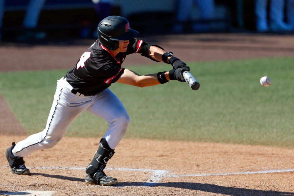 Mountlake Terrace’s Tyler Shankle tries to lay down a bunt against Edmonds-Woodway in the Class 3A District 1 baseball championship Saturday, May 11, 2024, at Funko Field in Everett, Washington. (Ryan Berry / The Herald)
