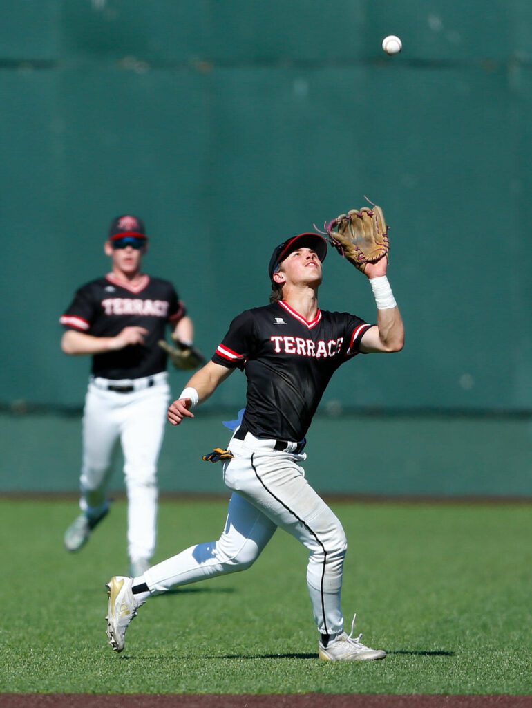 Mountlake Terrace senior Talan Zenk fights the sun and catches a pop up against Edmonds-Woodway in the Class 3A District 1 baseball championship Saturday, May 11, 2024, at Funko Field in Everett, Washington. (Ryan Berry / The Herald)

