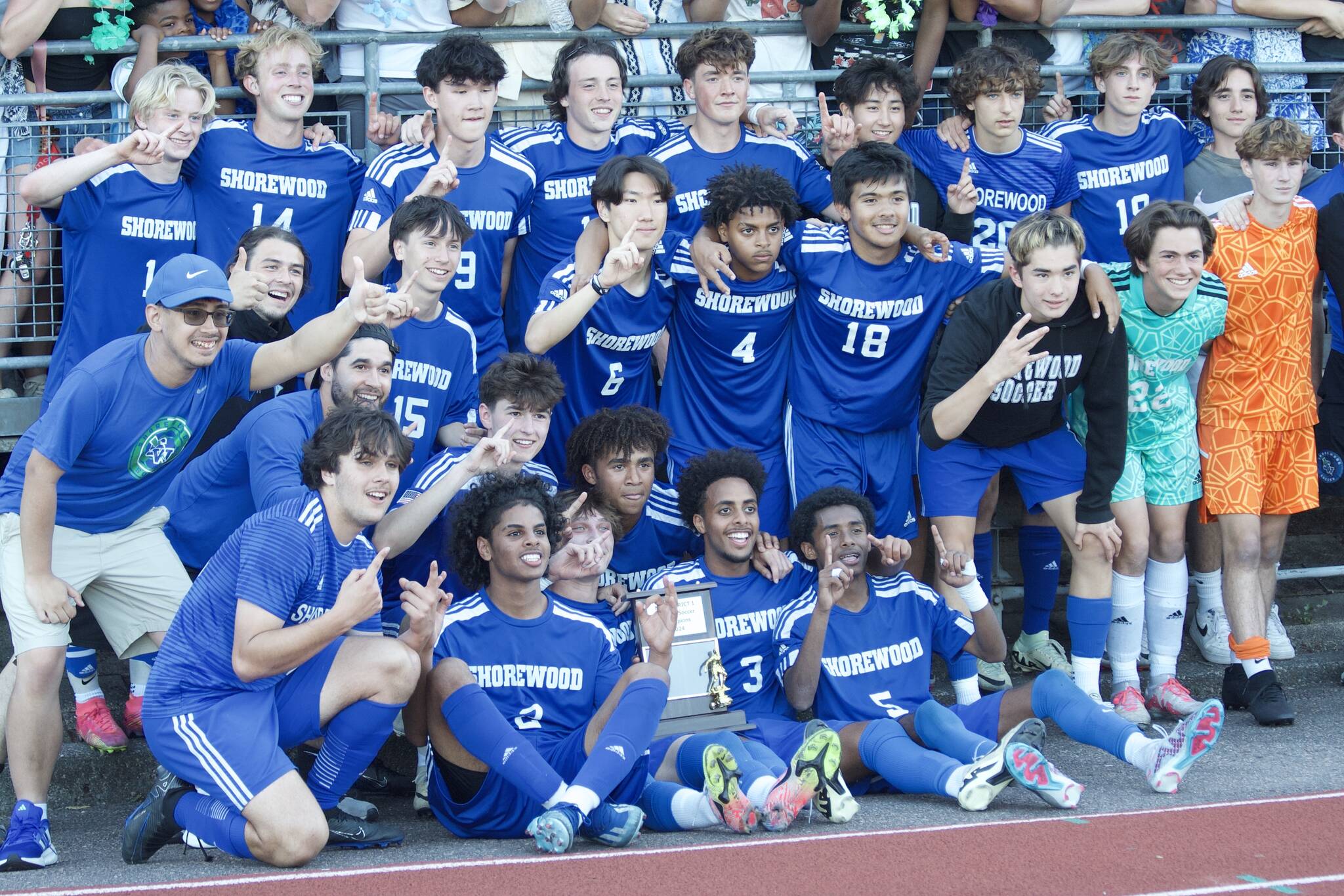 The Shorewood boys soccer team poses for a photo after winning the Class 3A District 1 trophy Saturday at Shoreline Stadium. The Stormrays topped Edmonds-Woodway 2-1. (Taras McCurdie / The Herald)