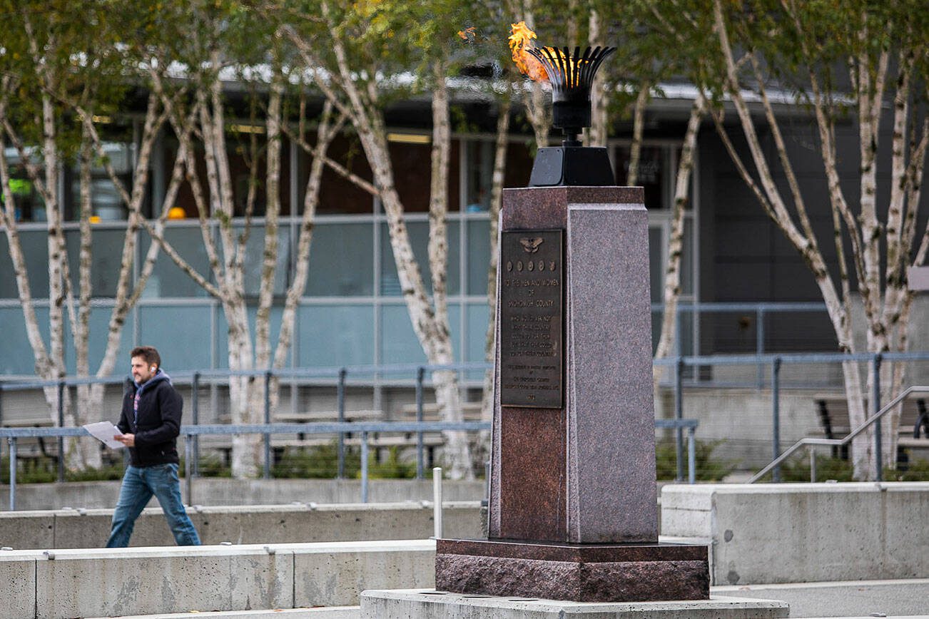The Eternal Flame monument burns in the center of the Snohomish County Campus on Thursday, Nov. 3, 2022 in Everett, Washington. (Olivia Vanni / The Herald)