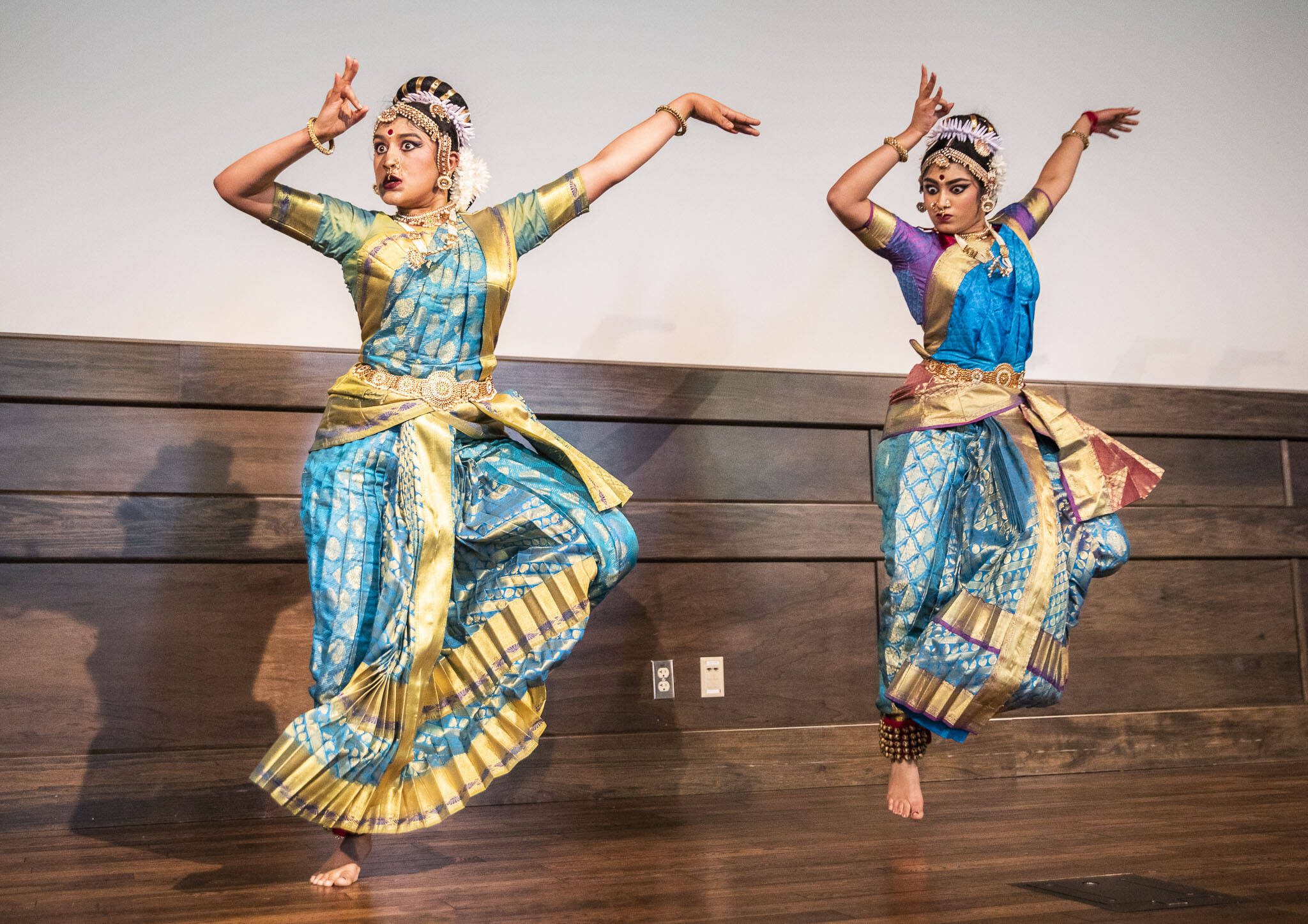 Sisters Anika Yechuri, 21, and Nithika Yechuri, 18, perform during the Desi Dazzle event at Everett Community College on Tuesday, May 14, 2024 in Everett, Washington. (Olivia Vanni / The Herald)