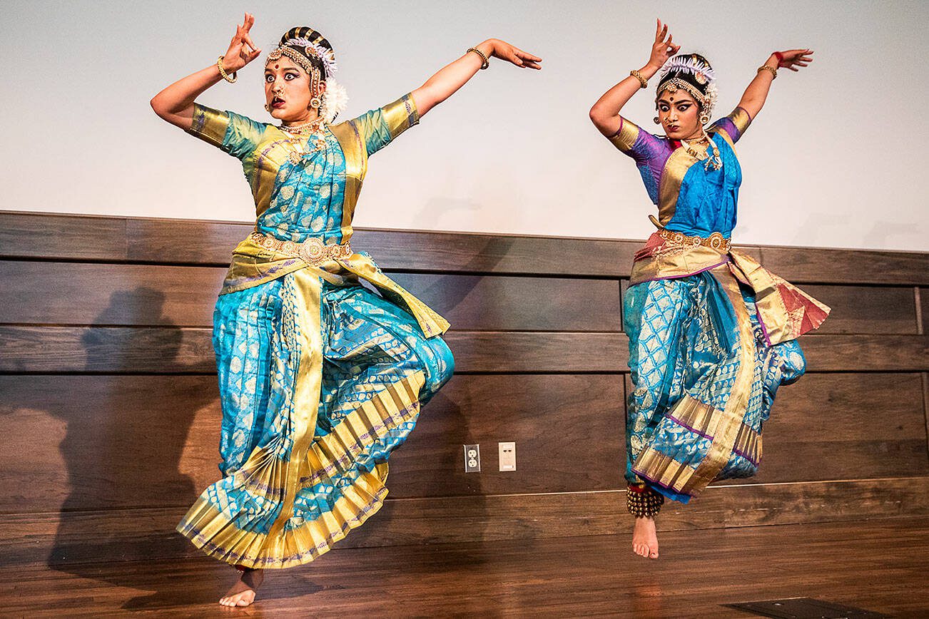 Sisters Anika Yechuri, 21, and Nithika Yechuri, 18, perform during the Desi Dance event at Everett Community College on Tuesday, May 14, 2024 in Everett, Washington. (Olivia Vanni / The Herald)