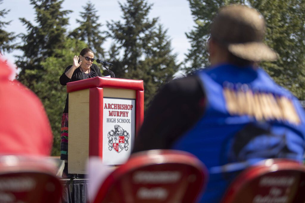 Tulalip Tribes Board of Directors Chair Teri Gobin speaks during a ceremony for the healing pole students spent the last year carving along with Tulalip carver James Madison at Archbishop Murphy High School in Everett, Washington on Wednesday, May 15, 2024. (Annie Barker / The Herald)
