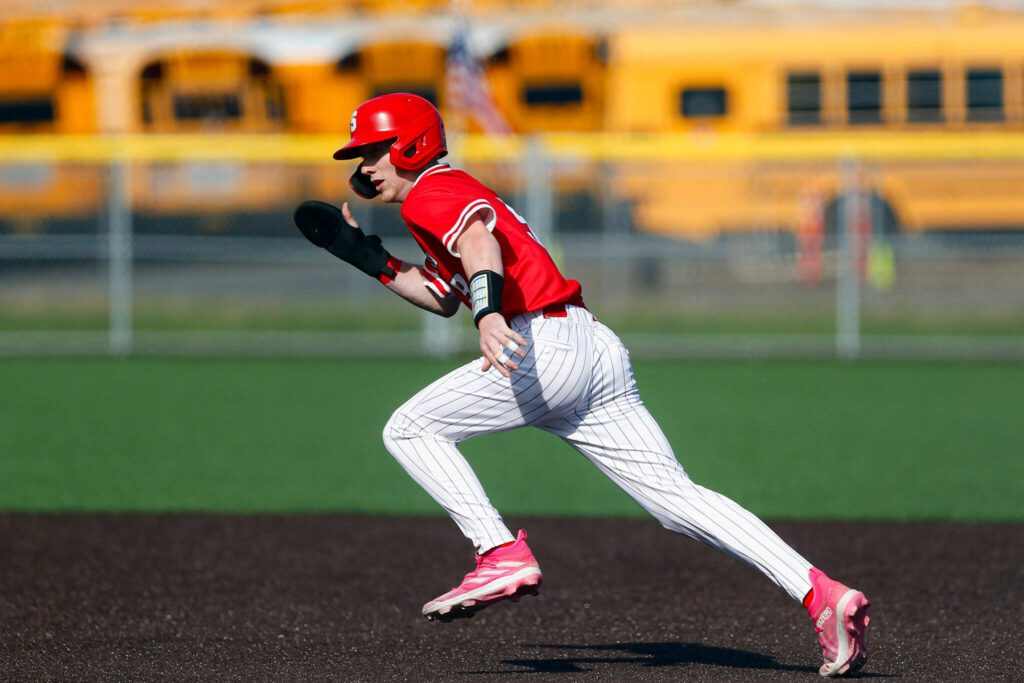 Stanwood’s TJ McQuery takes off for second base during a playoff loss to Kentlake on Tuesday, May 14, 2024, at Kent Meridian High School in Kent, Washington. (Ryan Berry / The Herald)
