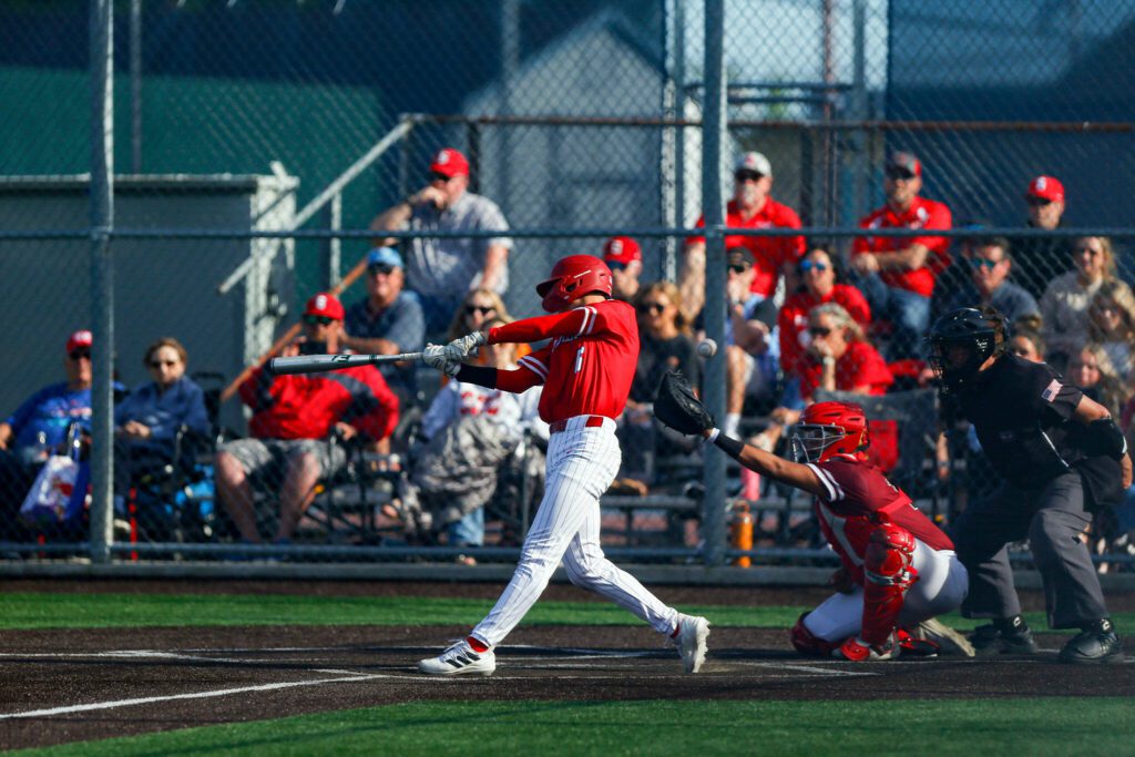 Stanwood’s Gavin Gehrman spoils a two-strike pitch during a playoff loss to Kentlake on Tuesday, May 14, 2024, at Kent Meridian High School in Kent, Washington. (Ryan Berry / The Herald)

