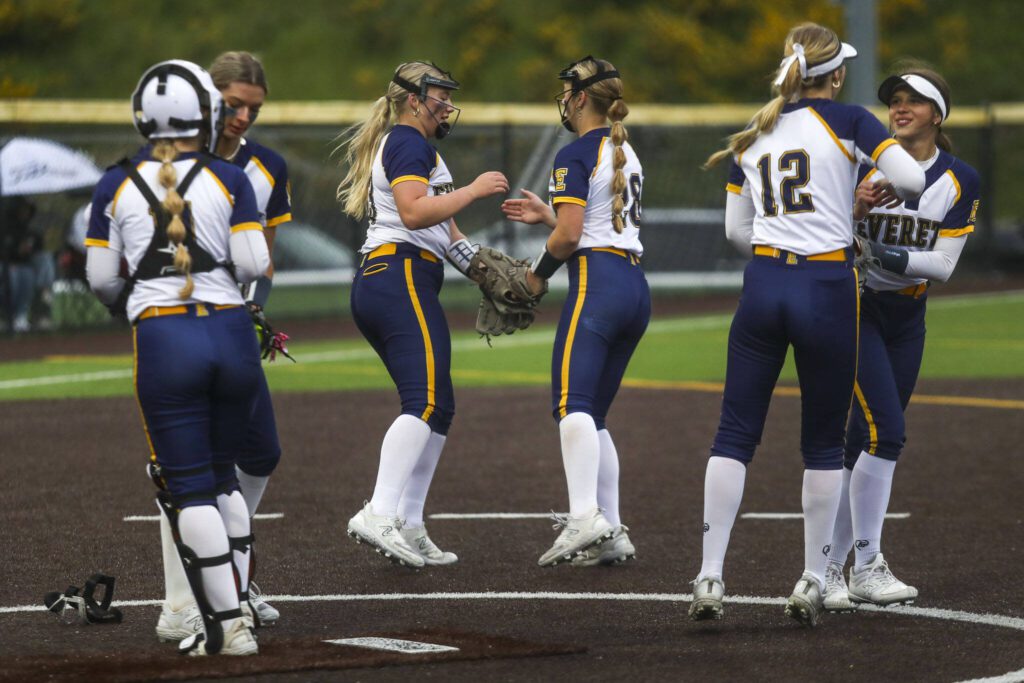 Everett players celebrate during a Class 3A District 1 softball championship game between Snohomish and Everett at Phil Johnson Fields in Everett, Washington on Thursday, May 16, 2024. Everett won, 10-0. (Annie Barker / The Herald)
