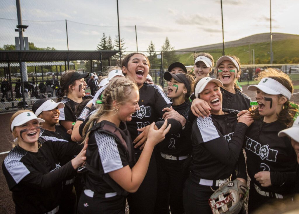 Jackson players react to beating Kamiak to win the 4A district championship on Friday, May 17, 2024 in Everett, Washington. (Olivia Vanni / The Herald)
