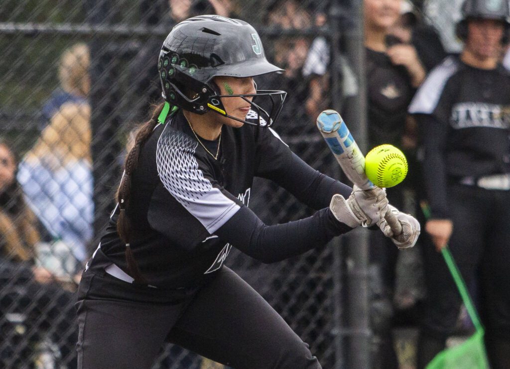 Jackson’s Kiana Holden bunts the ball during the 4A district championship against Kamiak on Friday, May 17, 2024 in Everett, Washington. (Olivia Vanni / The Herald)
