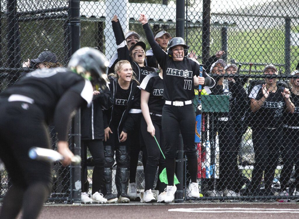 The Jackson dugout reacts to a hit during the 4A district championship against Kamiak on Friday, May 17, 2024 in Everett, Washington. (Olivia Vanni / The Herald)
